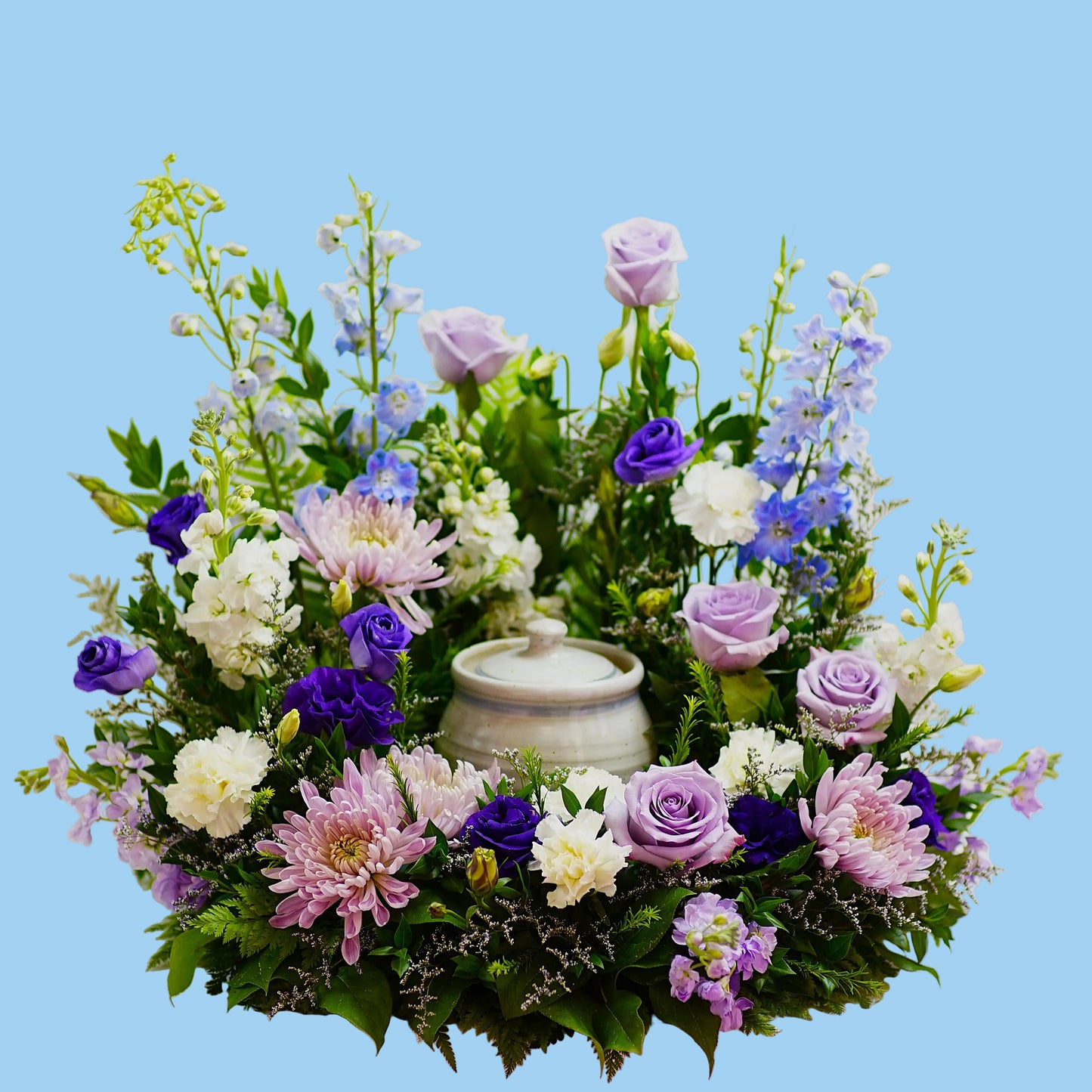 Floral arrangement with a urn on a white background